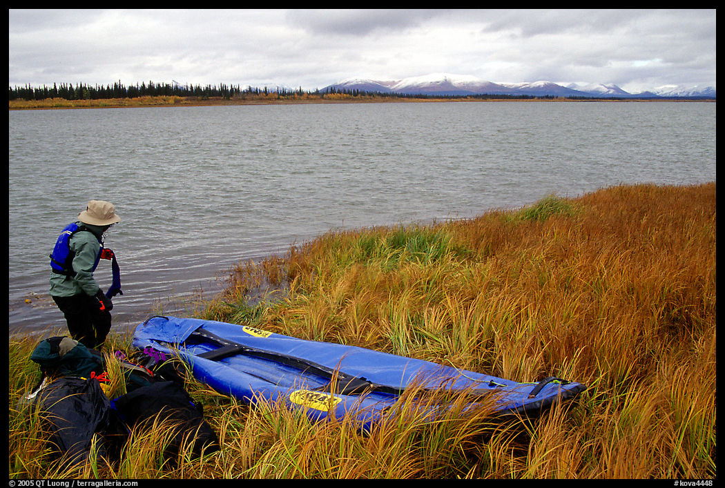 Canoeist deflating the canoe. Kobuk Valley National Park, Alaska