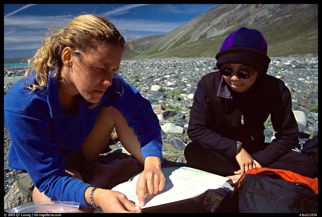 Women hikers consulting a map. Lake Clark National Park, Alaska