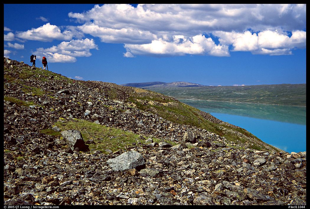 Backpackers on a ridge above Turquoise Lake. Lake Clark National Park, Alaska