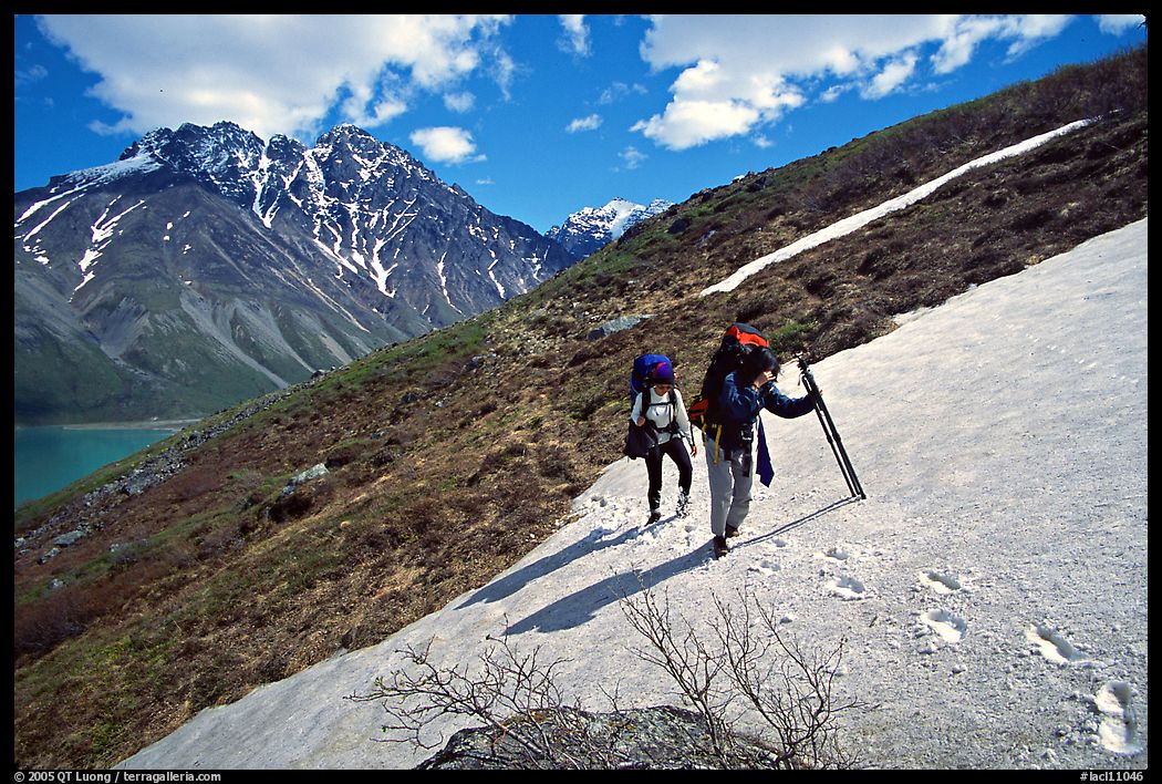 Backpackers crossing a neve. Lake Clark National Park, Alaska