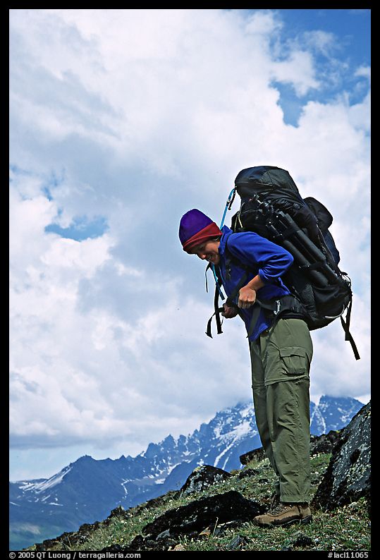 Woman backpacker with a large backpack. Lake Clark National Park, Alaska