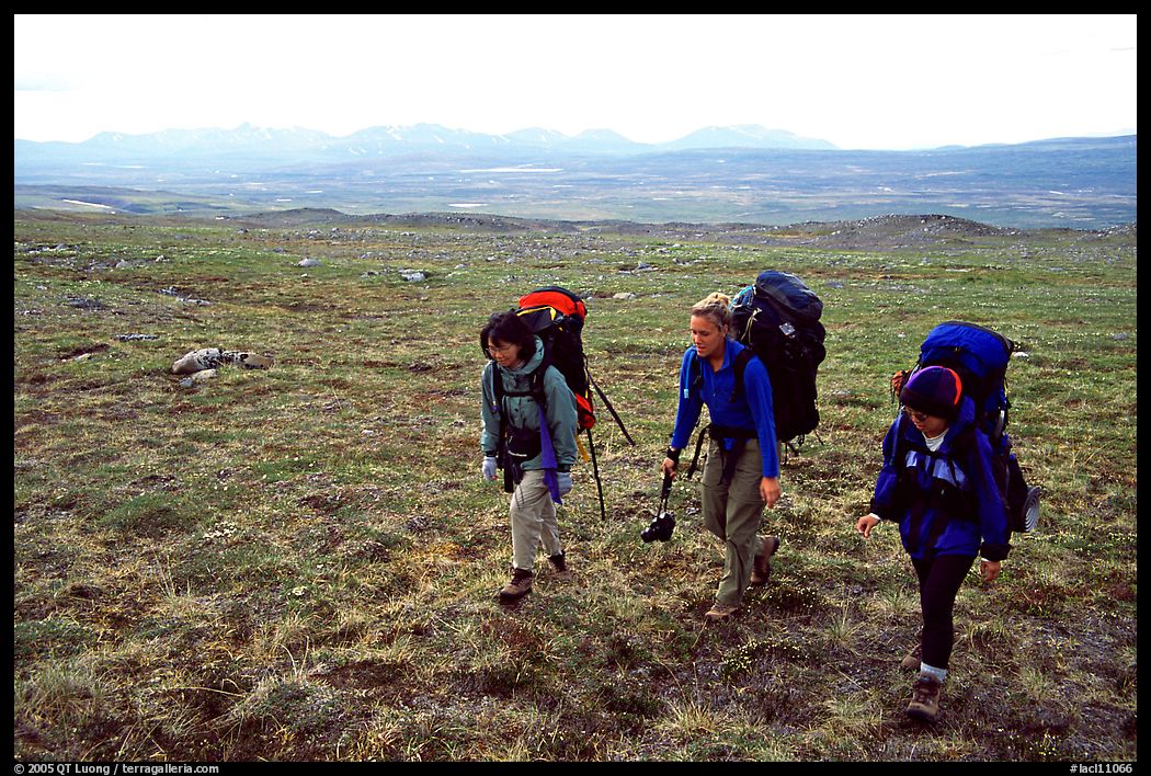 Three women backpackers walking in the tundra. Lake Clark National Park, Alaska