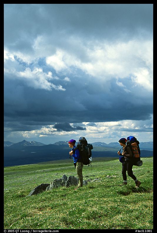 Backpackers seen from the side in the tundra. Lake Clark National Park, Alaska