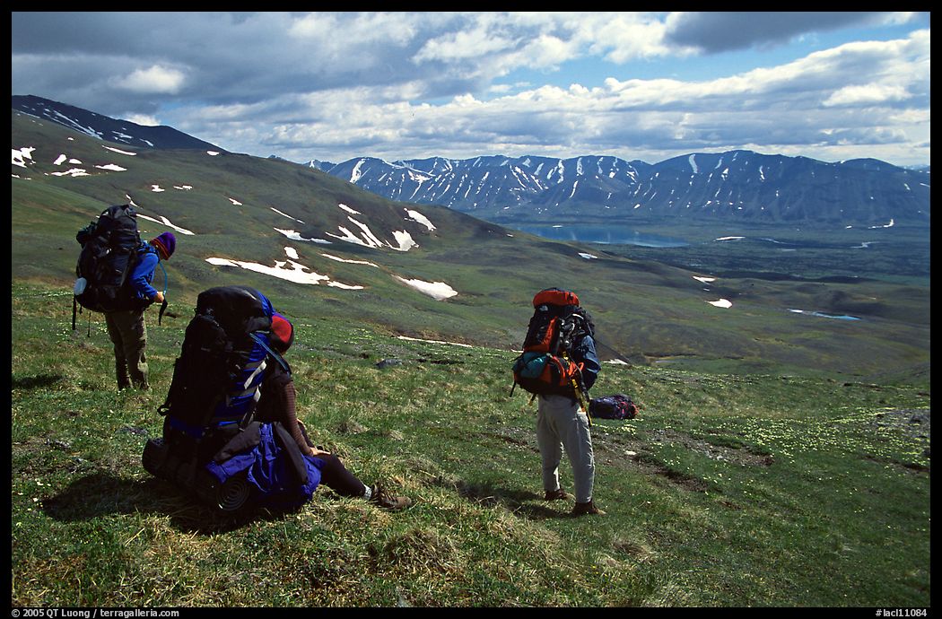 Backpackers take a pause when arriving on sight of Twin Lakes. Lake Clark National Park, Alaska