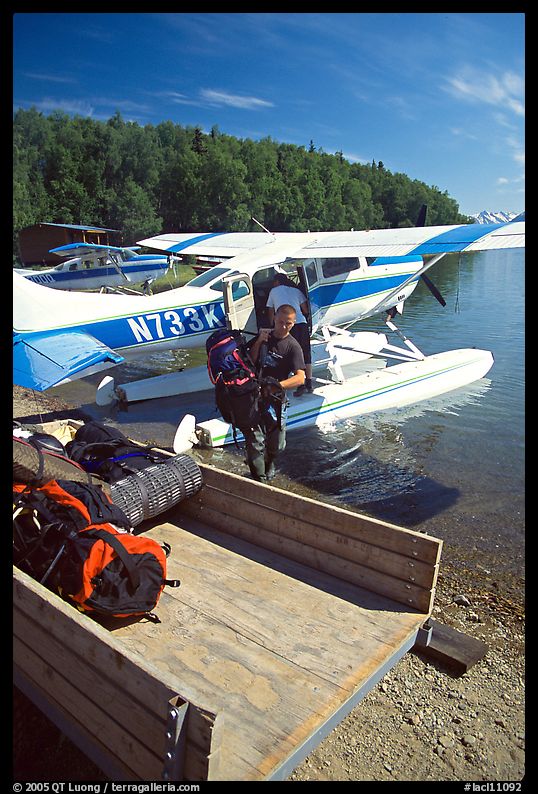 Backpackes being unloaded from floatplane in Port Alsworth. Lake Clark National Park, Alaska
