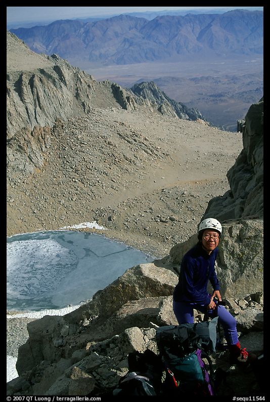 Woman gearing up to climb  East face of Mt Whitney. Sequoia National Park, California