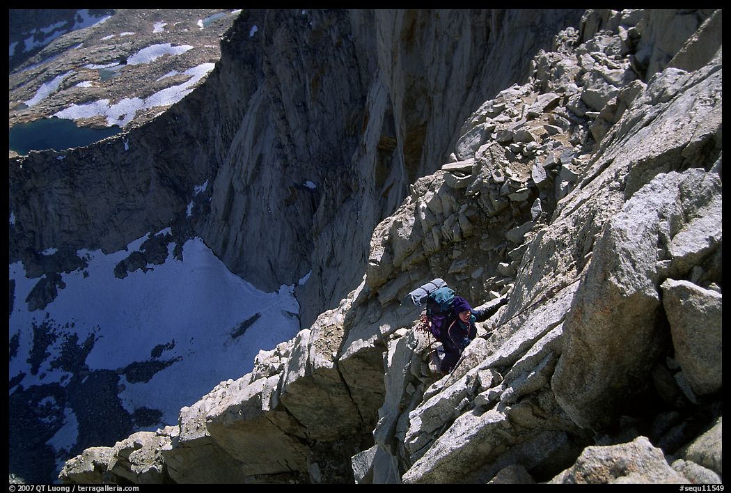 Mountaineer among broken rocks in the East face of Mt Whitney. Sequoia National Park, California