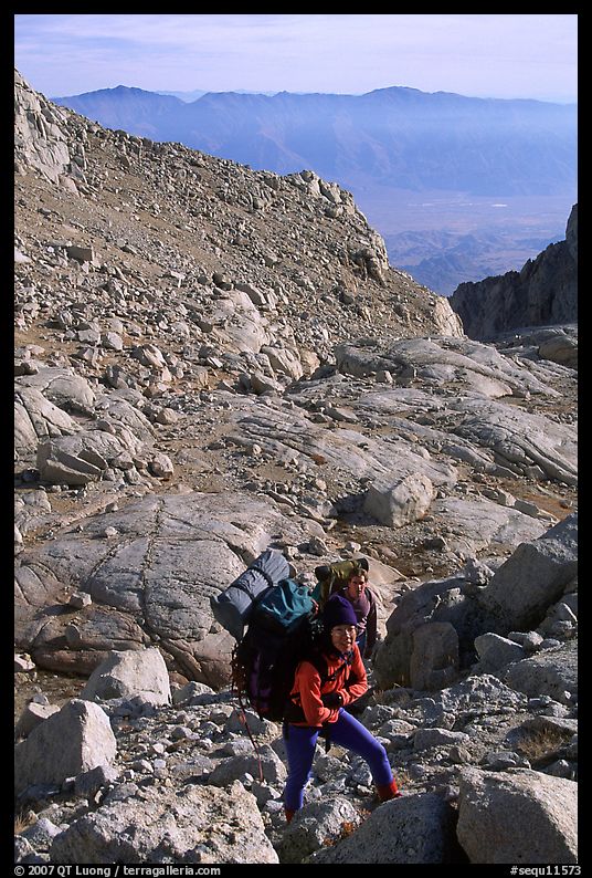 Mountaineers hiking on approach to  East face of Mt Whitney. Sequoia National Park, California