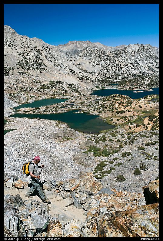 Hiker on trail above Saddlebag Lakes, John Muir Wilderness. Kings Canyon National Park, California