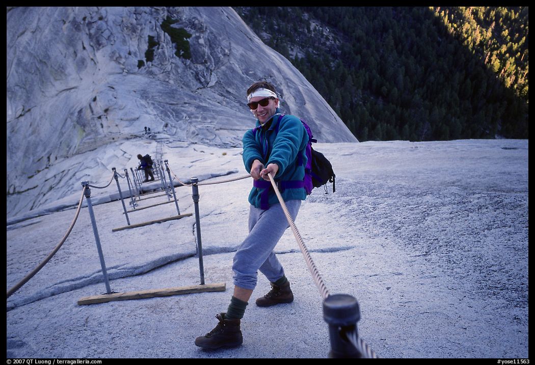 Hiker and cables on the regular route to Half-Dome. Yosemite National Park, California