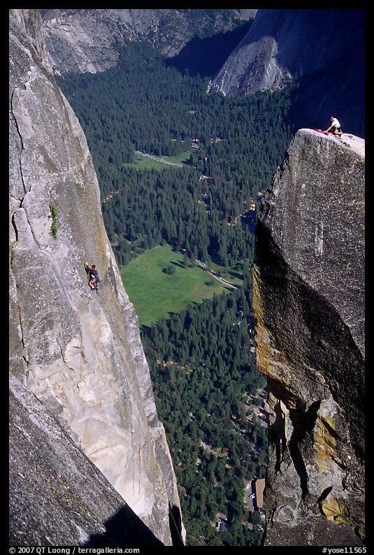 Climbers on Lost Arrow spire and Yosemite falls wall. Yosemite National Park, California