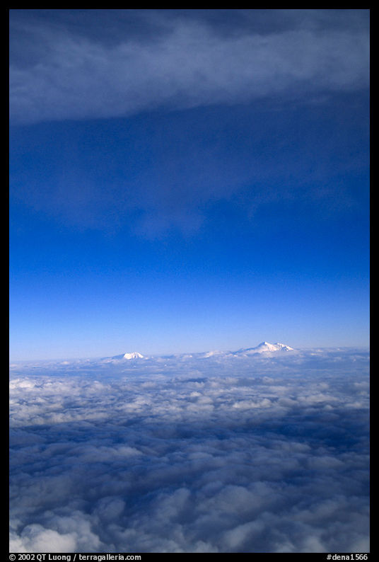 Mt Foraker and Mt Mc Kinley emerge from  sea of clouds. Denali  National Park, Alaska, USA.