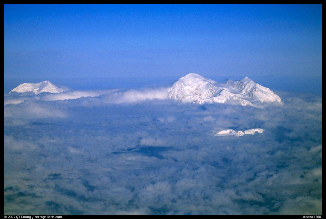 Mt Foraker and Mt Mc Kinley emerge from a sea of clouds. Denali  National Park, Alaska, USA.