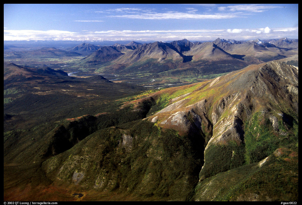 Aerial view of mountains with meandering Alatna river in the distance. Gates of the Arctic National Park, Alaska, USA.