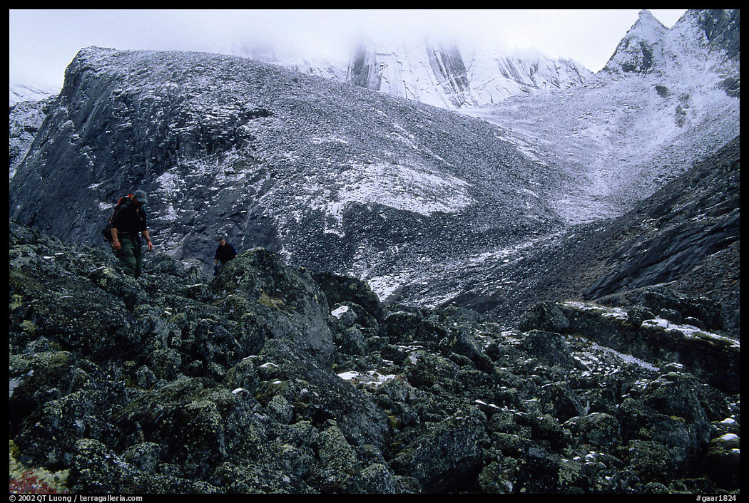 Backpackers on boulder fields in Aquarius Valley. Gates of the Arctic National Park, Alaska