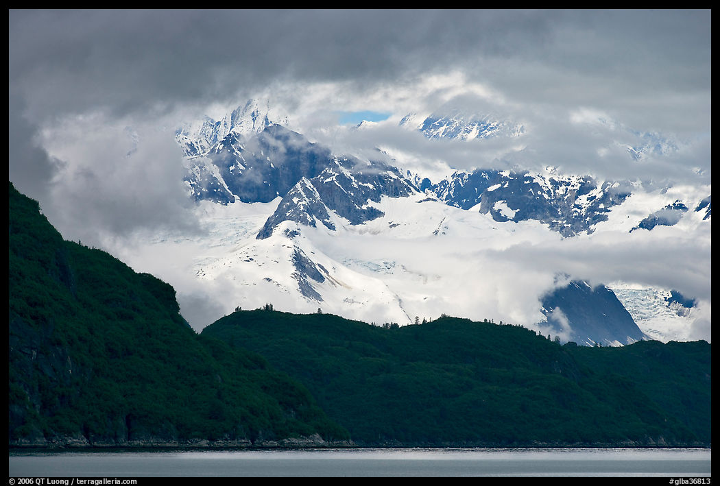 Dark ridge and cloud shrouded peaks, West Arm. Glacier Bay National Park, Alaska, USA.