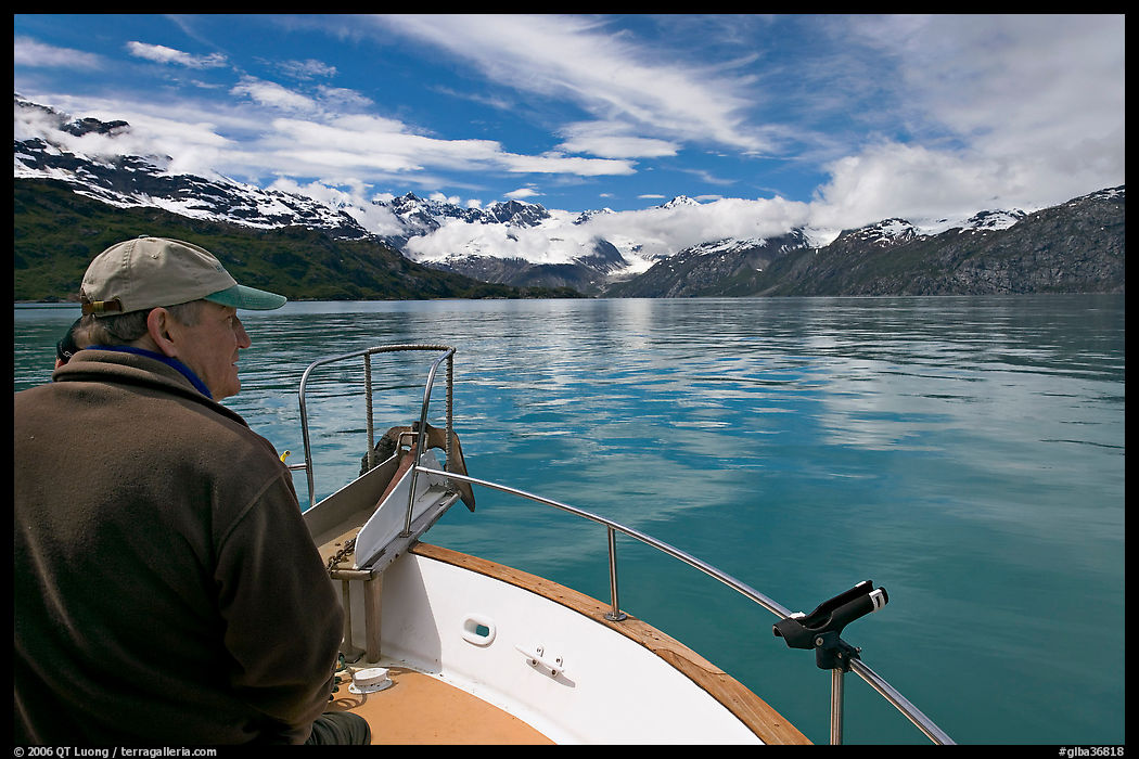 Man sitting at the bow of a small boat. Glacier Bay National Park