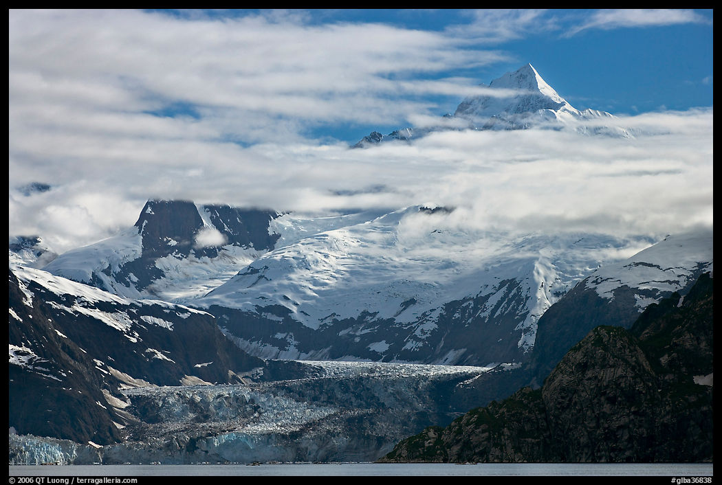 Pointed peaks of Fairweather range emerging from clouds. Glacier Bay National Park, Alaska, USA.
