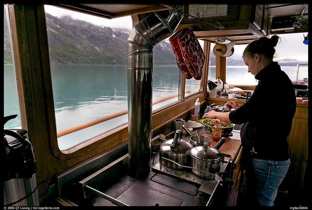 Chef preparing sadad in the main cabin of the Kahsteen. Glacier Bay National Park