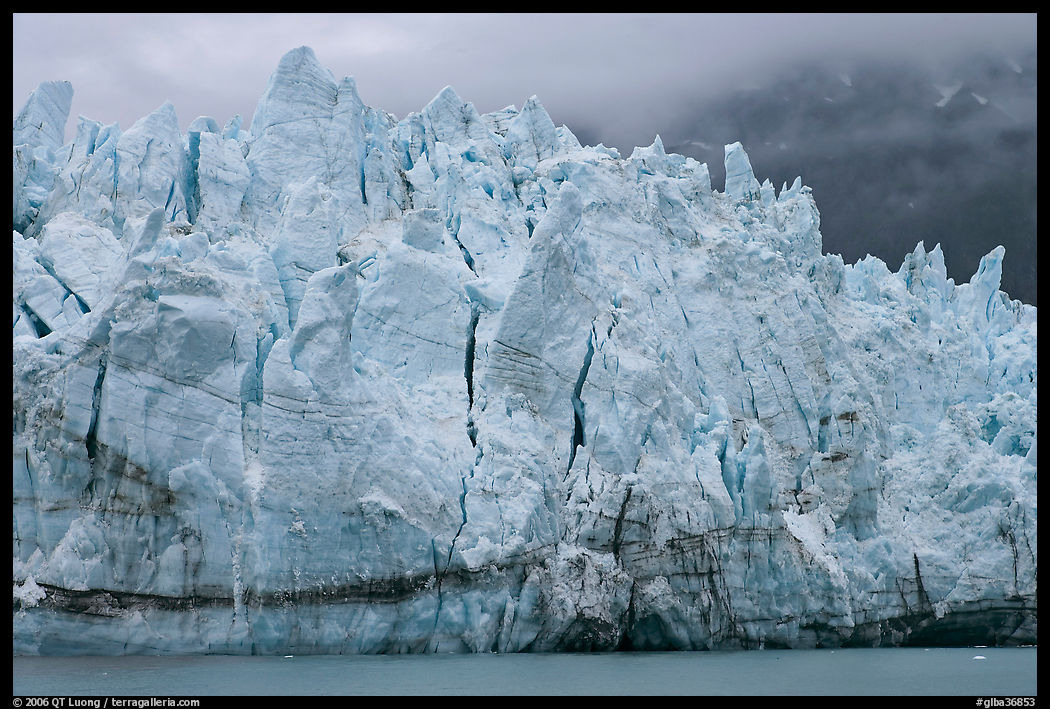 Blue ice on the tidewater terminus of Margerie Glacier. Glacier Bay National Park, Alaska, USA.