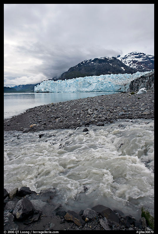 Stream flowing into Tarr Inlet, with Margerie Glacier in background. Glacier Bay National Park, Alaska, USA.