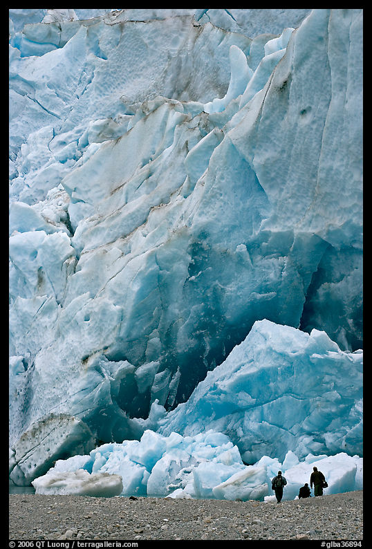 People at the base of the Reid Glacier terminus. Glacier Bay National Park, Alaska, USA.