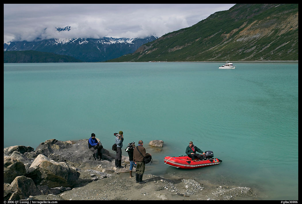 Film crew met by a skiff after shore excursion. Glacier Bay National Park, Alaska, USA.