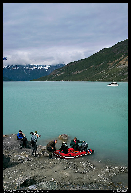 Film crew embarking on a skiff after shore excursion. Glacier Bay National Park, Alaska, USA.