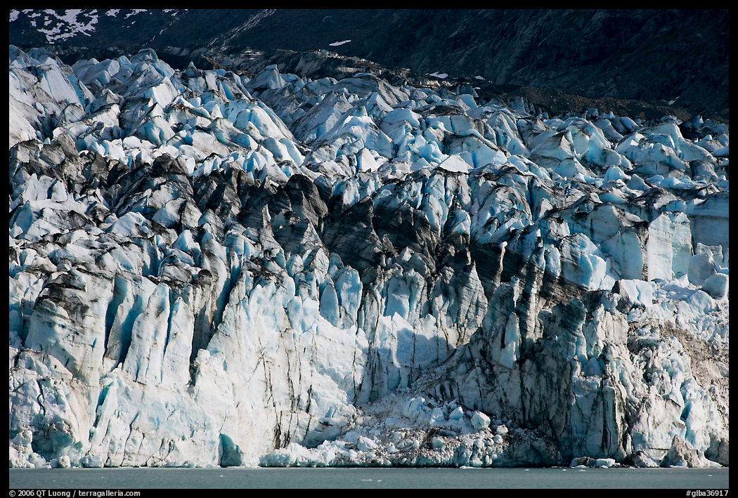 Tidewater ice front of Lamplugh glacier. Glacier Bay National Park, Alaska, USA.