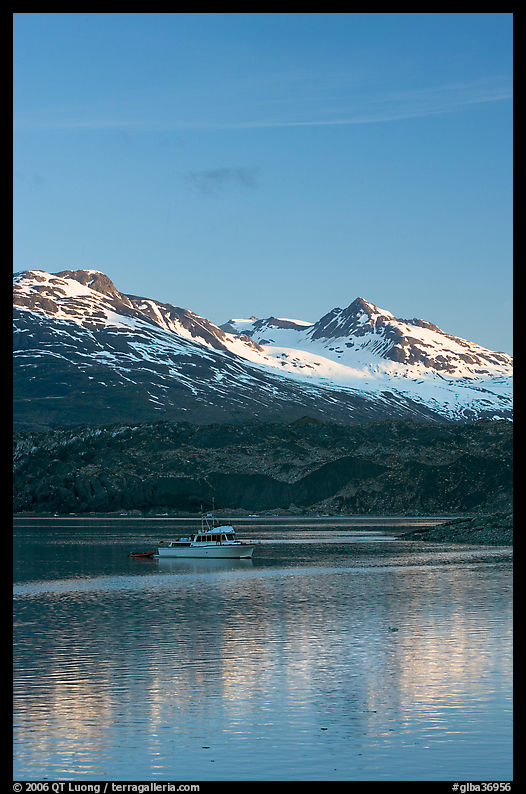 Small boat at the head of Tarr Inlet, early morning. Glacier Bay National Park, Alaska, USA.