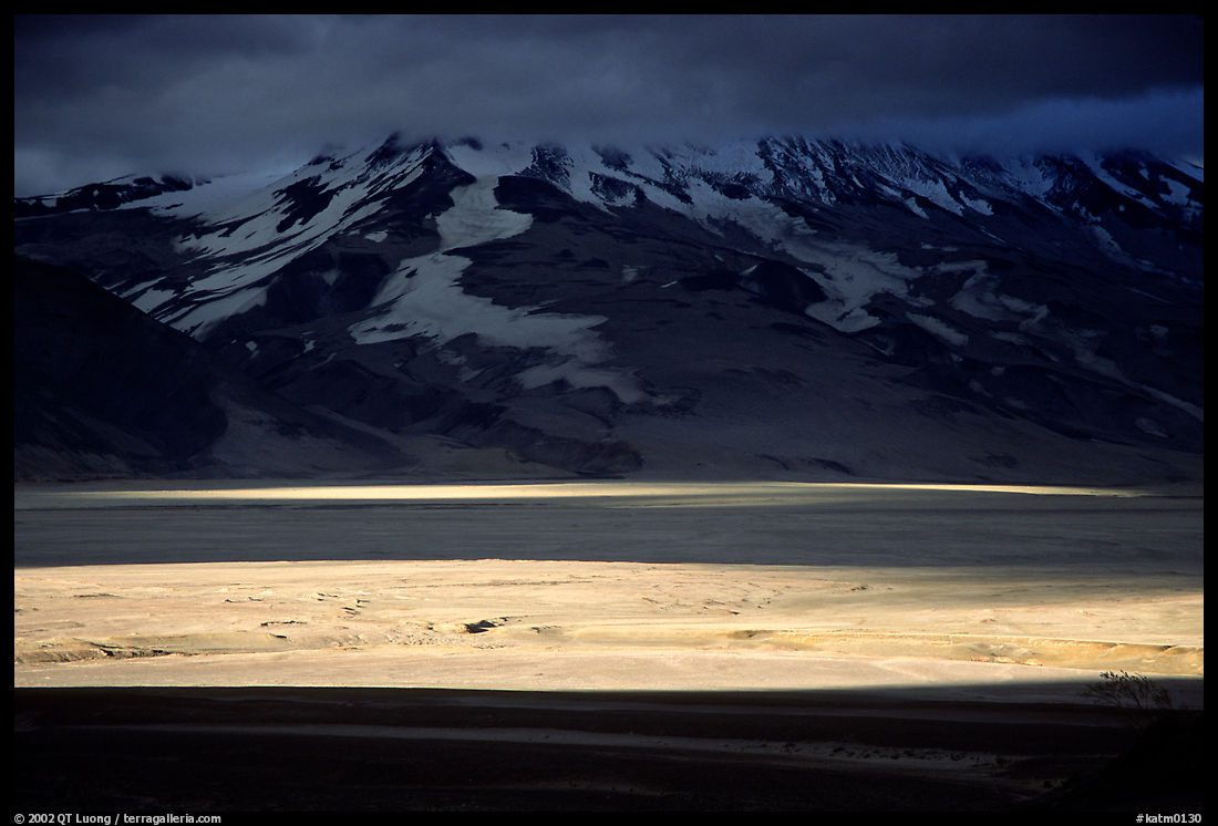 A break in the clouds illuminate the floor of the Valley of Ten Thousand smokes. Katmai National Park, Alaska, USA.