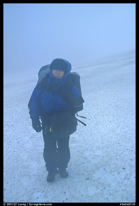 Backpacker in white-out conditions, Valley of Ten Thousand smokes. Katmai National Park, Alaska