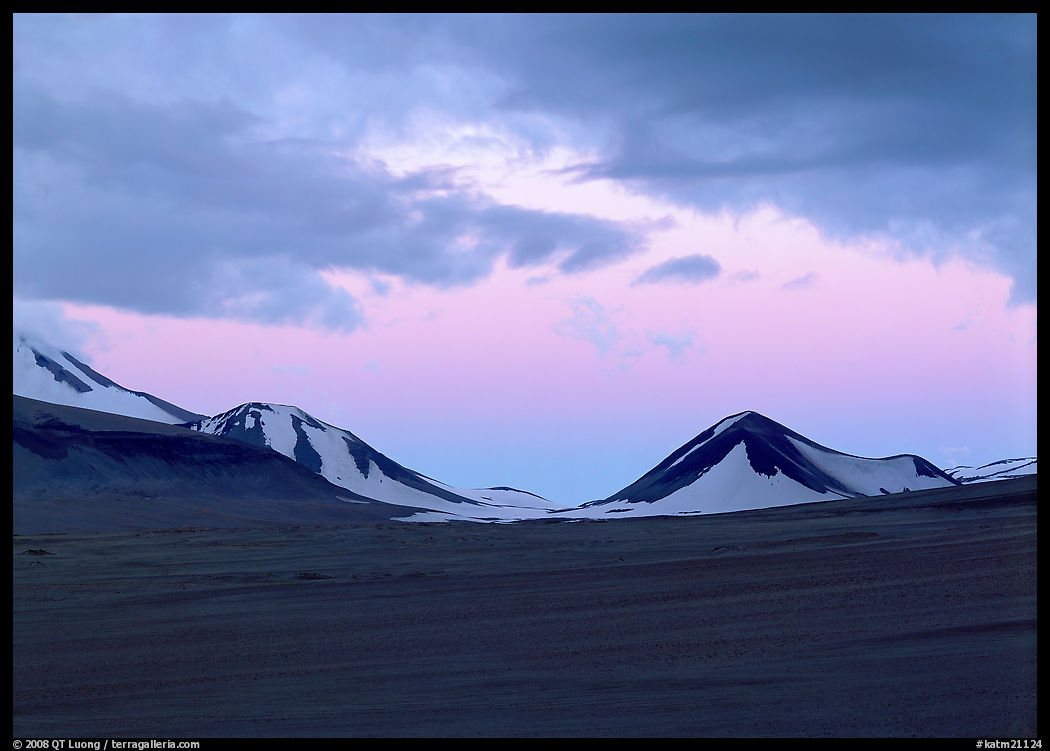 Mt Meigeck emerging above ash plain of Valley of Ten Thousand Smokes at dusk. Katmai National Park, Alaska, USA.