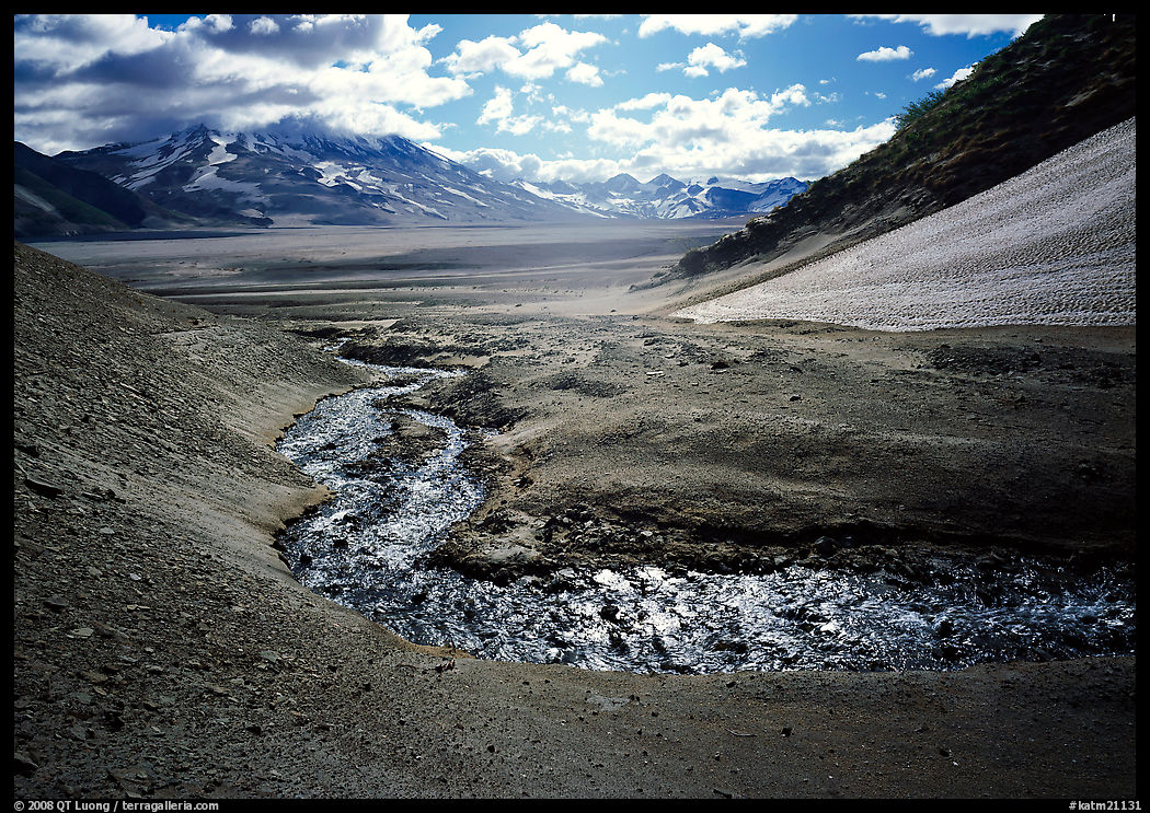 Stream flows from the hills into the floor of the Valley of Ten Thousand smokes. Katmai National Park, Alaska, USA.