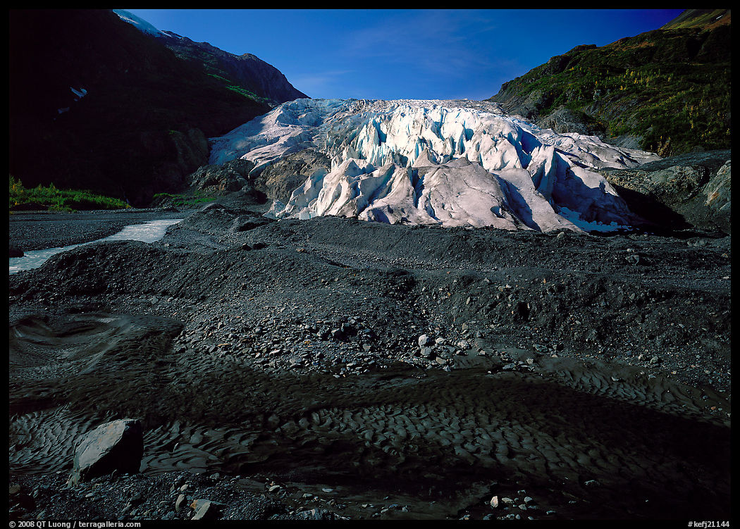 Dark glacial plain floor and Exit Glacier. Kenai Fjords  National Park, Alaska, USA.