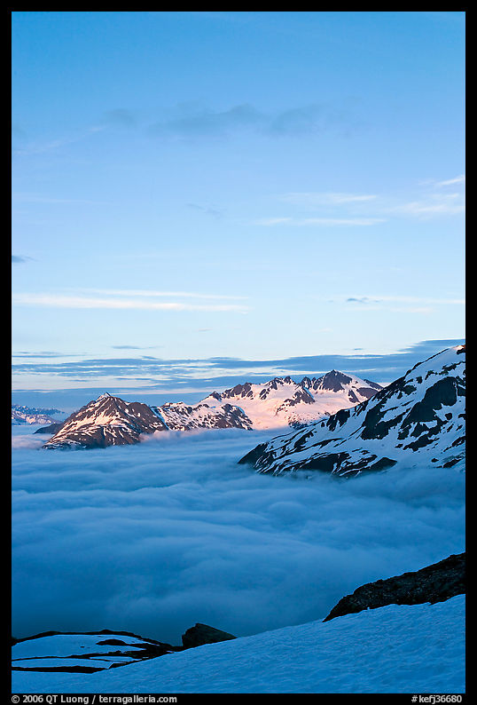 Snowy mountains and see of clouds at sunset. Kenai Fjords  National Park