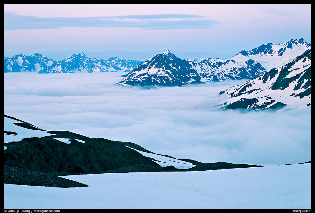 Mountains above low fog at dusk. Kenai Fjords  National Park, Alaska, USA.