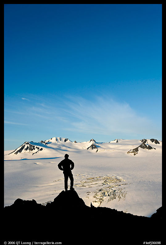 Hiker standing on overlook above Harding icefield. Kenai Fjords  National Park