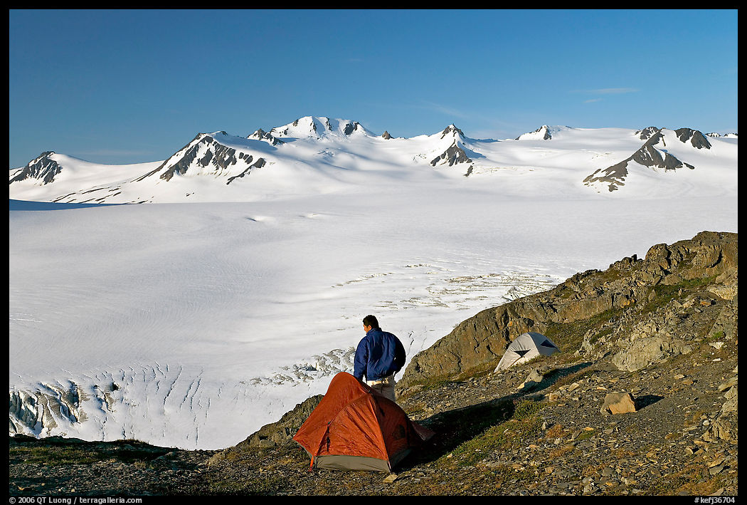 Tent and backpacker above the Harding icefield. Kenai Fjords  National Park, Alaska, USA.