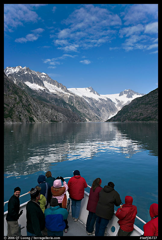 Mountains reflected in fjord, seen by tour boat passengers, Northwestern Fjord. Kenai Fjords  National Park, Alaska, USA.