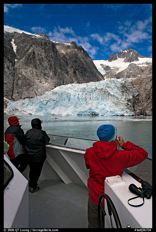 Passengers looking at Northwestern glacier from the deck of tour boat. Kenai Fjords  National Park, Alaska, USA.