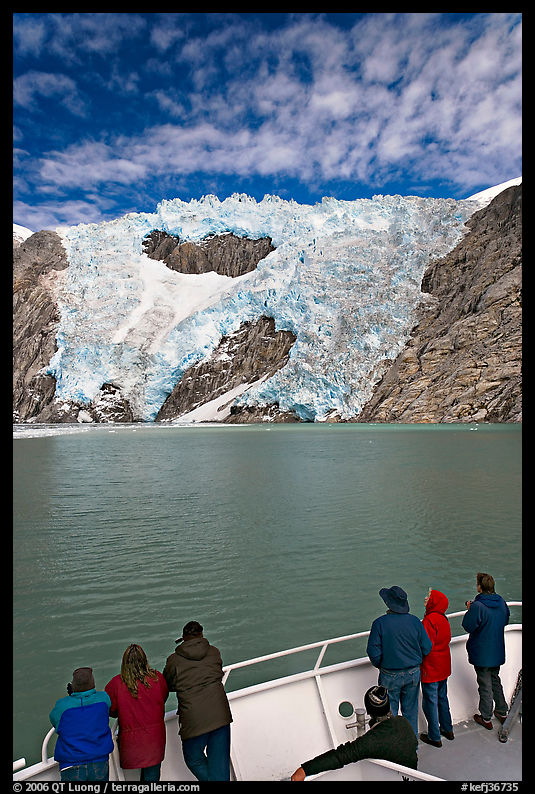 People watch  Northwestern glacier from deck of boat, Northwestern Lagoon. Kenai Fjords  National Park, Alaska, USA.