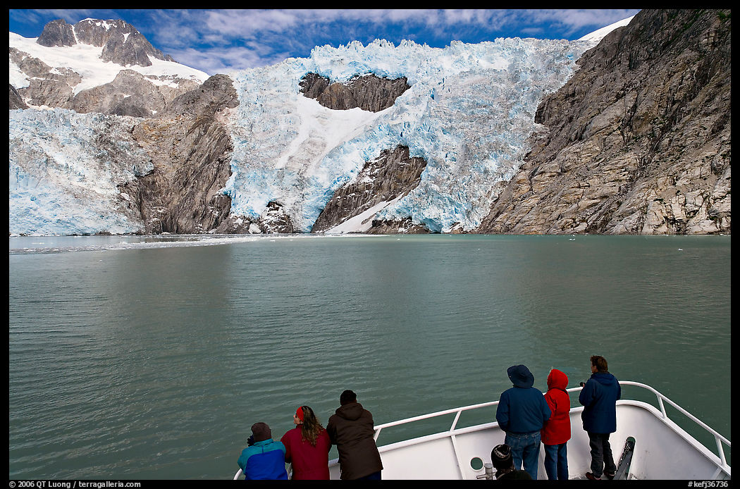 People looking at Northwestern glacier from deck of boat, Northwestern Fjord. Kenai Fjords  National Park, Alaska, USA.