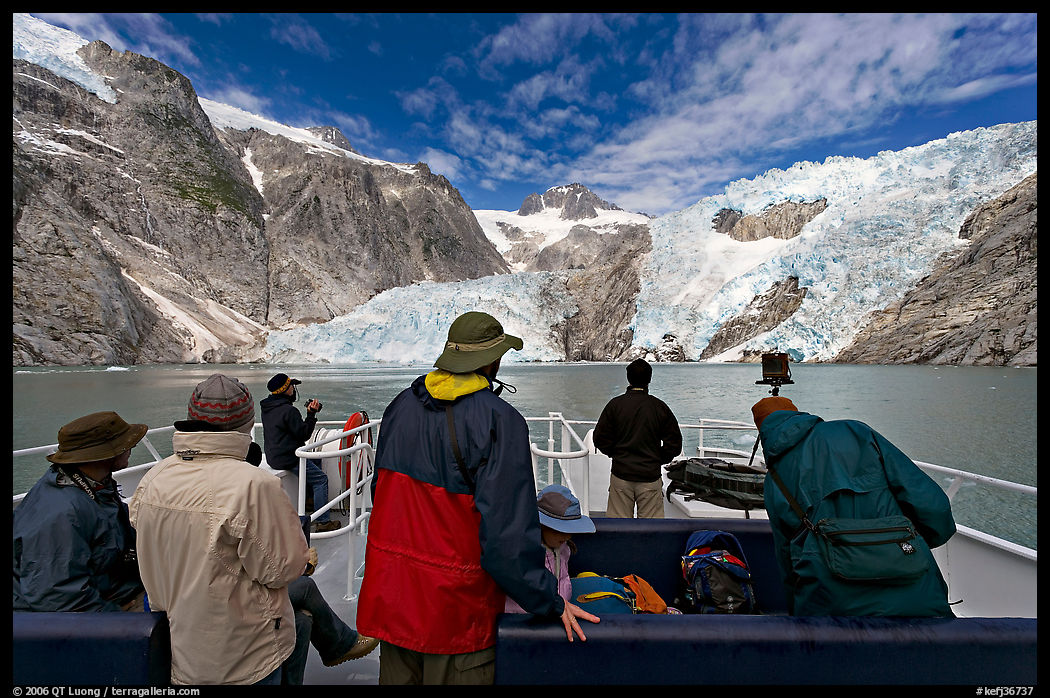 Passengers on the deck of tour boat and Northwestern glacier, Northwestern Lagoon. Kenai Fjords  National Park, Alaska, USA.