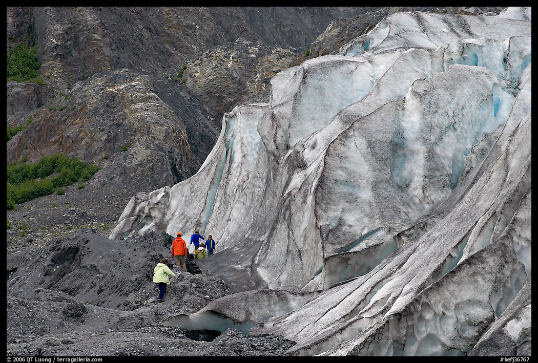Family exploring at the base of Exit Glacier. Kenai Fjords  National Park, Alaska, USA.