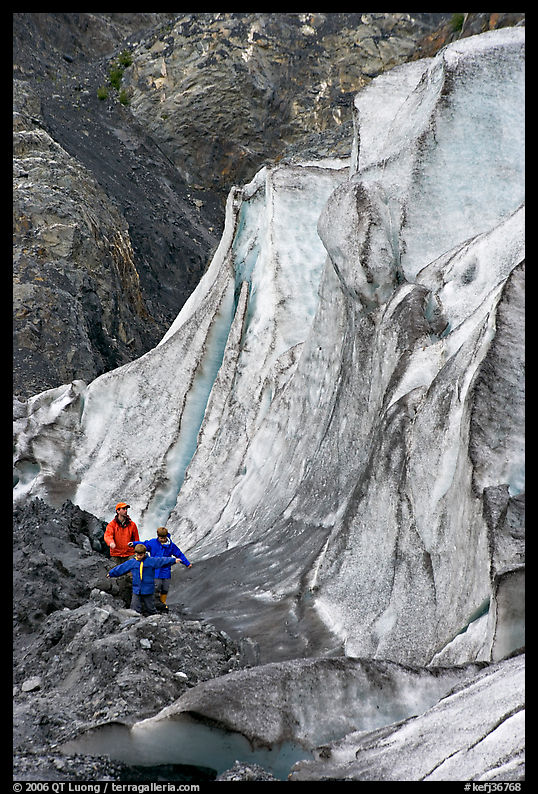 Man and children hiking on moraine at the base of Exit Glacier. Kenai Fjords  National Park, Alaska, USA.