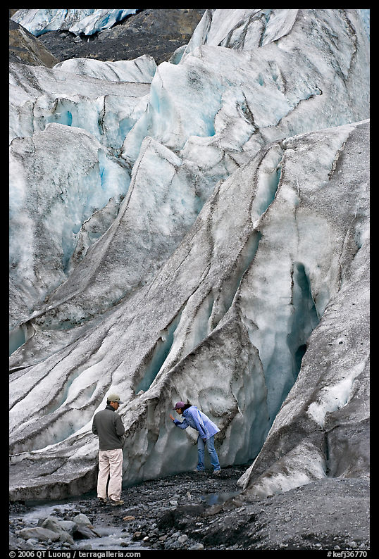 Couple checking out the ice at the terminus of Exit Glacier. Kenai Fjords  National Park, Alaska, USA.