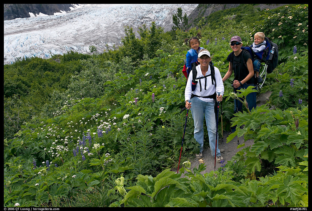 Women carrying infants on trail. Kenai Fjords  National Park, Alaska, USA.