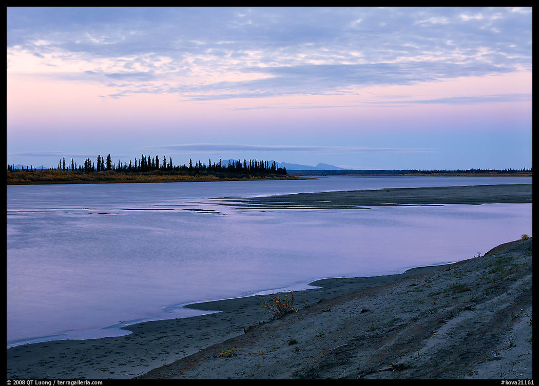 Low sandy shore of Kobuk River at dusk. Kobuk Valley National Park, Alaska, USA.