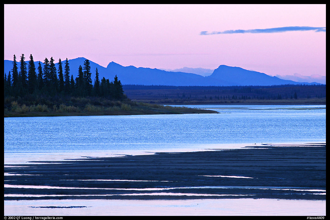 Sand bar shore, river and Baird mountains, evening. Kobuk Valley National Park, Alaska, USA.